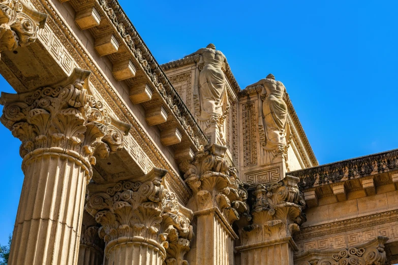 an ornate building with pillars and sculptures