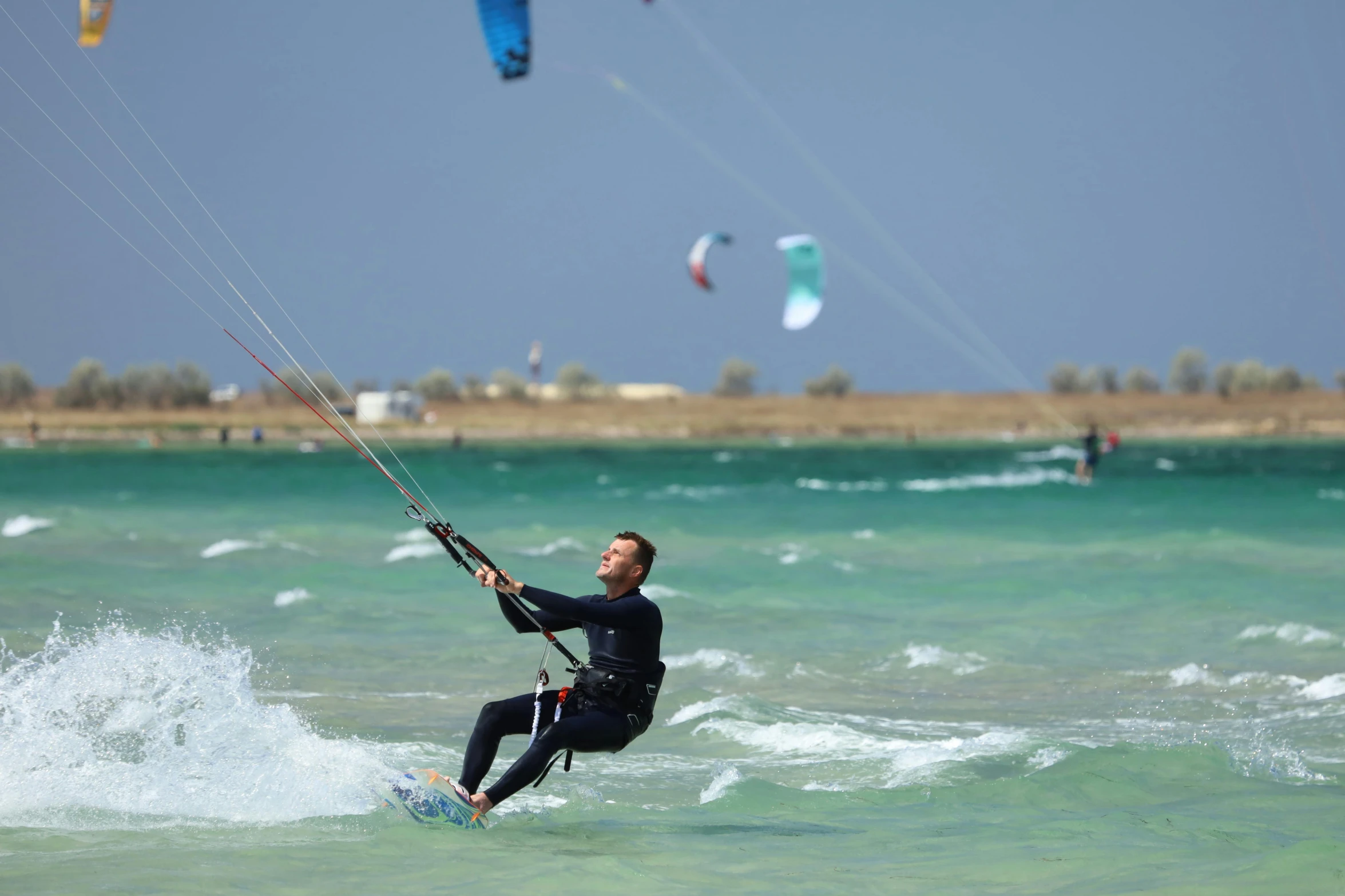 a person riding on a board on the water