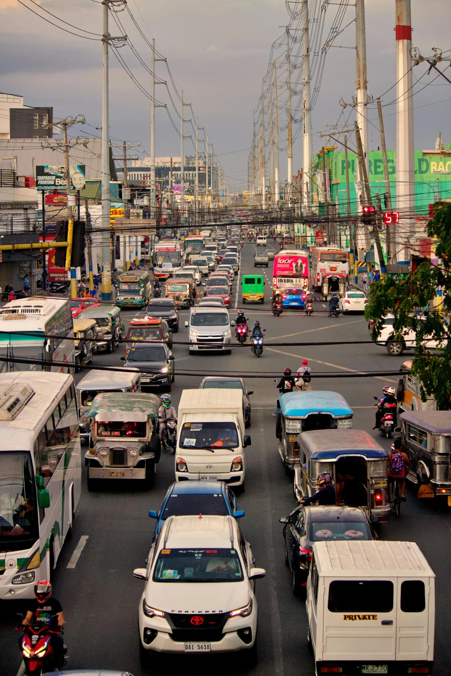 a highway filled with lots of cars driving down it