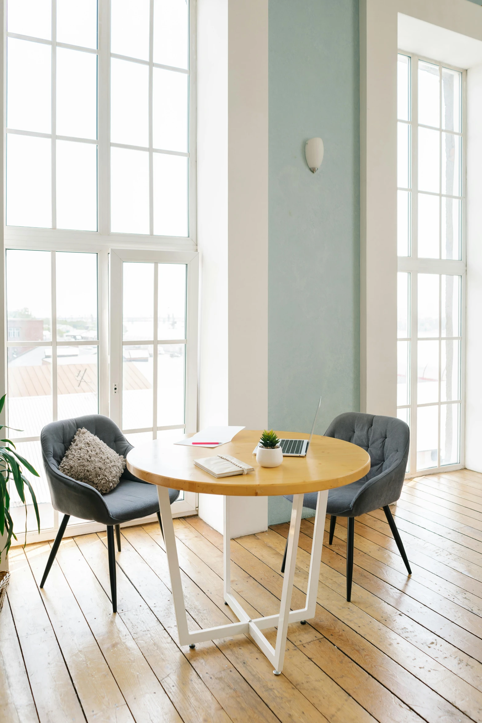 a table is set up in front of a large window