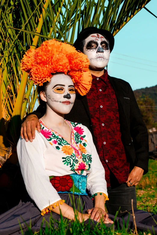 two people wearing halloween costumes standing next to each other