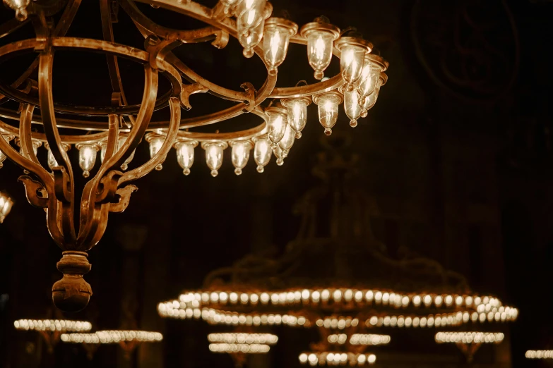 an ornate chandelier hangs in the ceiling