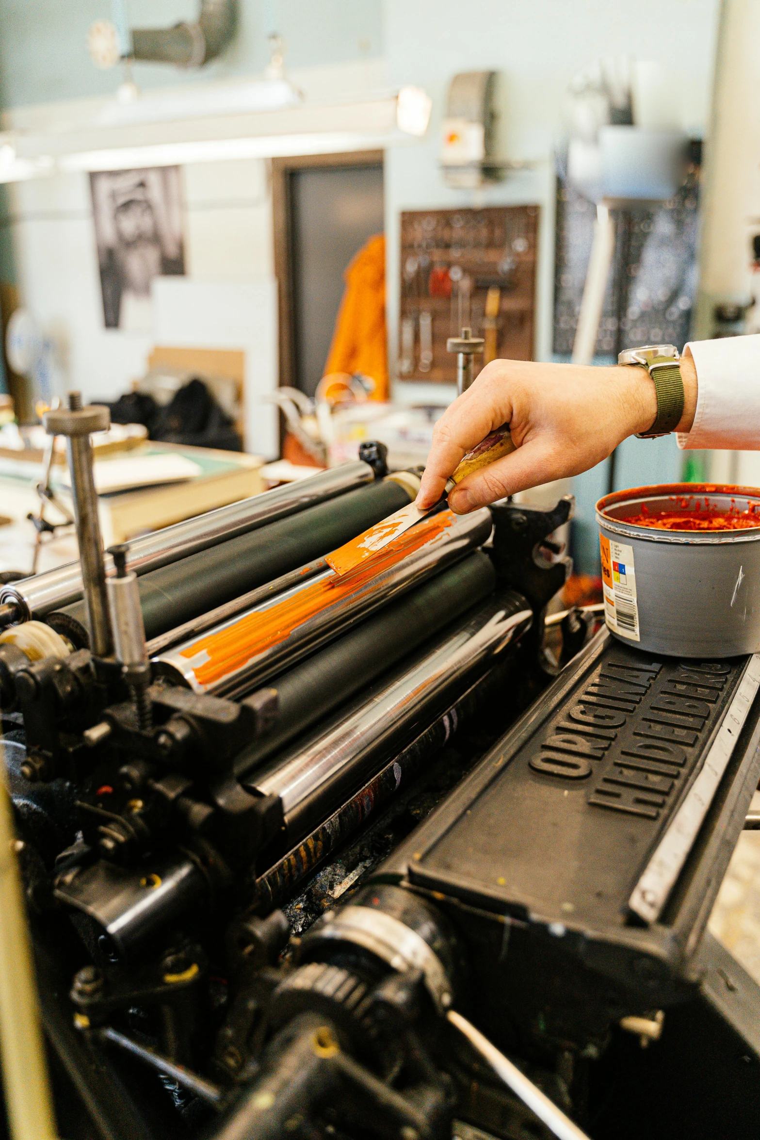 the woman is typing on the large printing machine