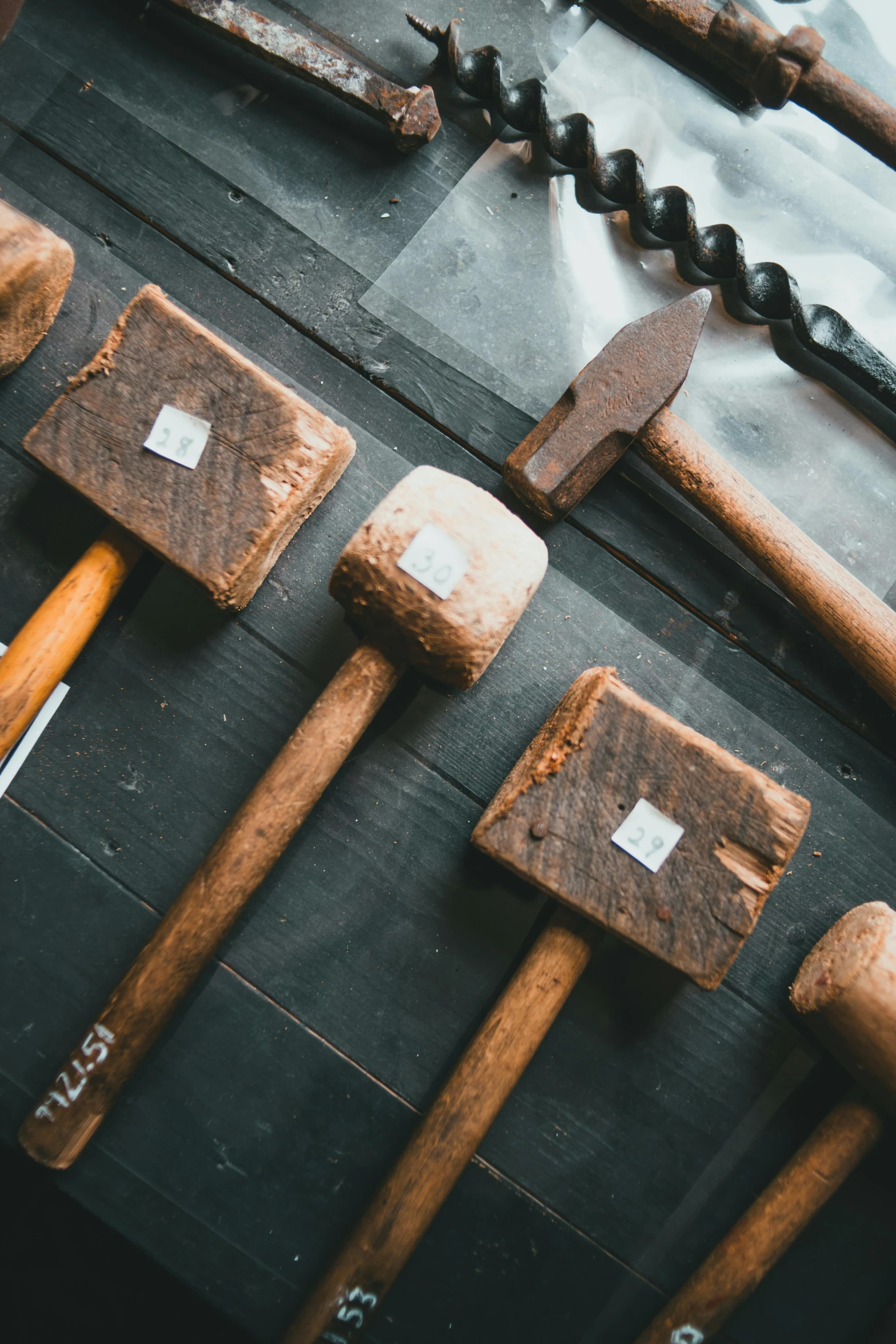 hammers and other tools are sitting on a table