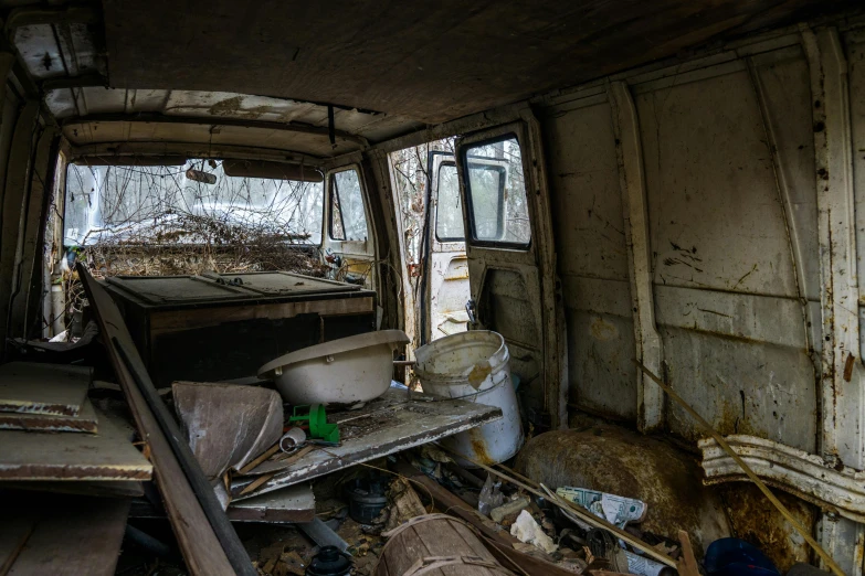 an abandoned garage filled with junk and old things