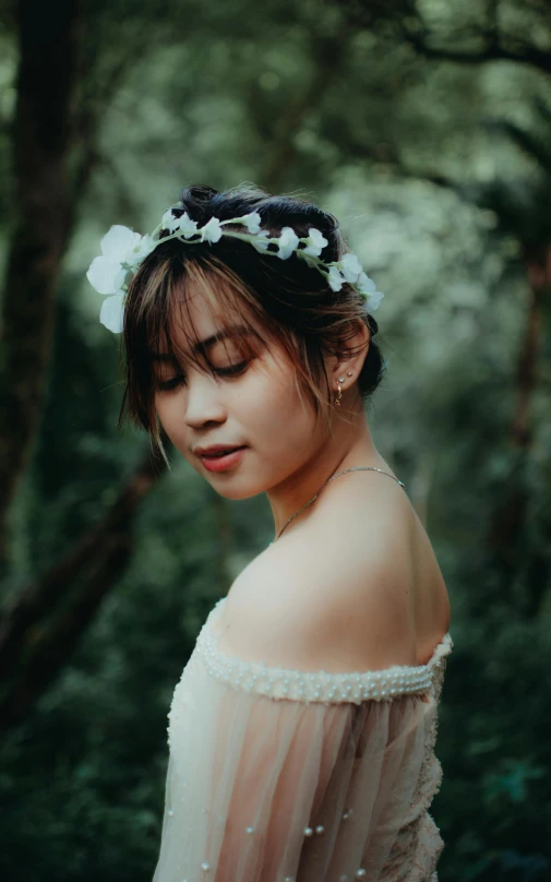 a young lady wearing a flower headband