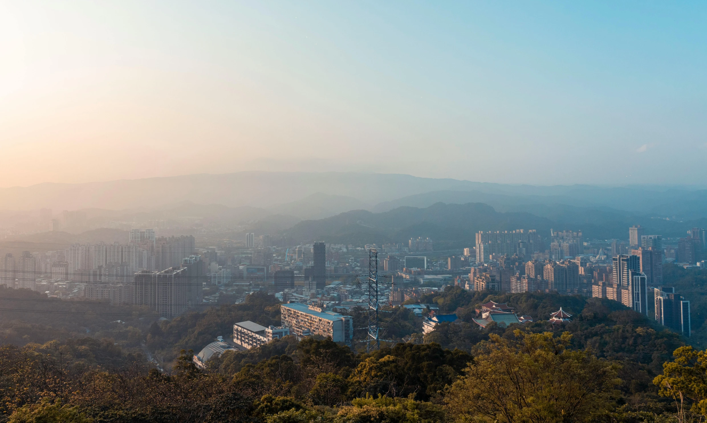 a city skyline with the top of some buildings