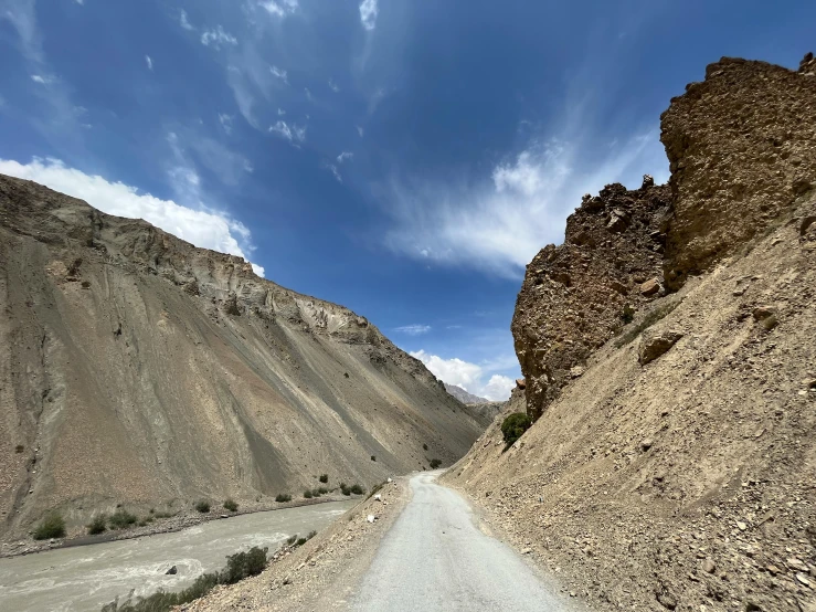 the view of a rocky and rocky landscape, with a road passing by