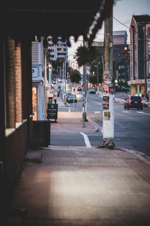 view down an empty city street at twilight