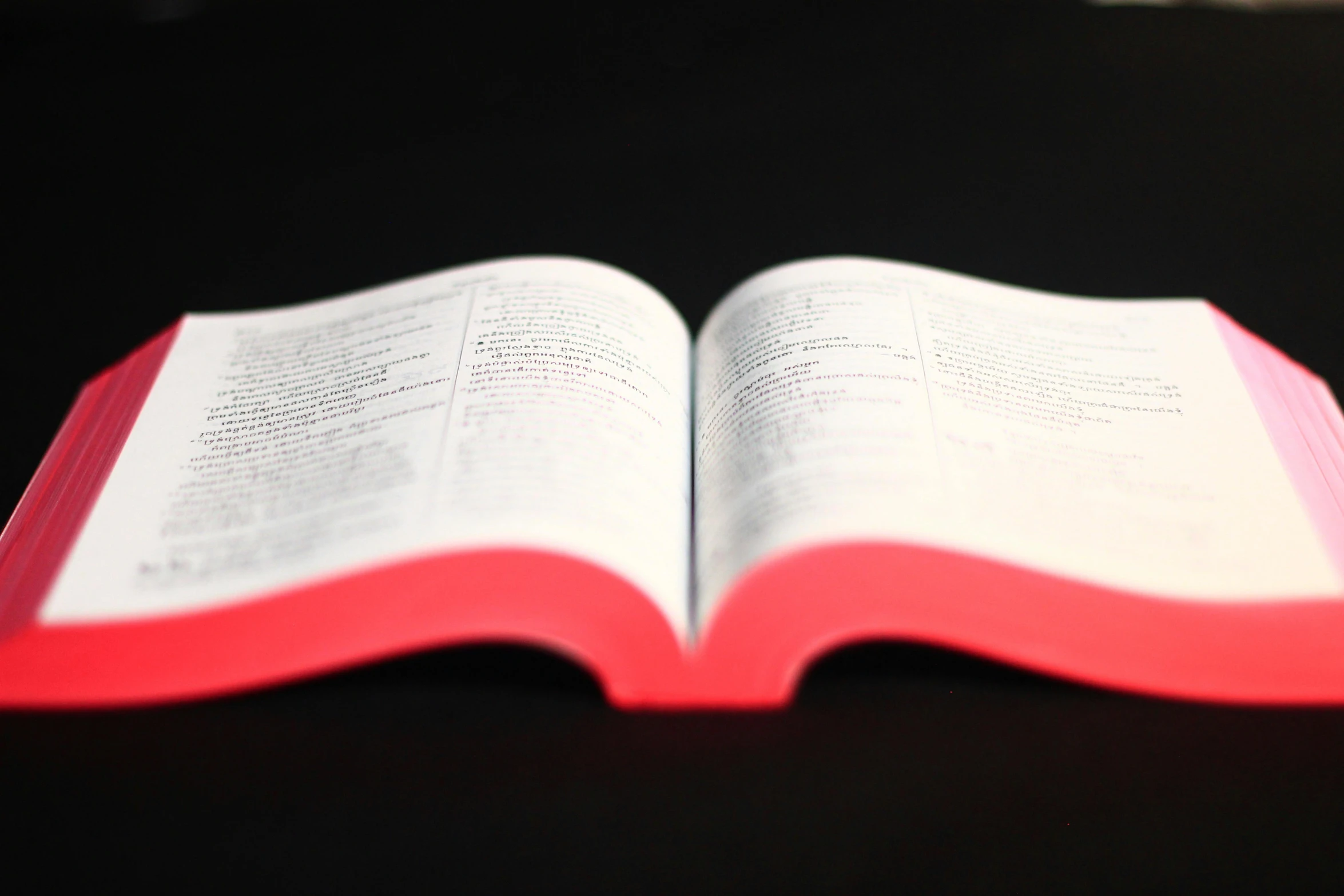 a red and white book on a table