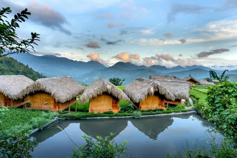 a body of water with a mountain range in the background