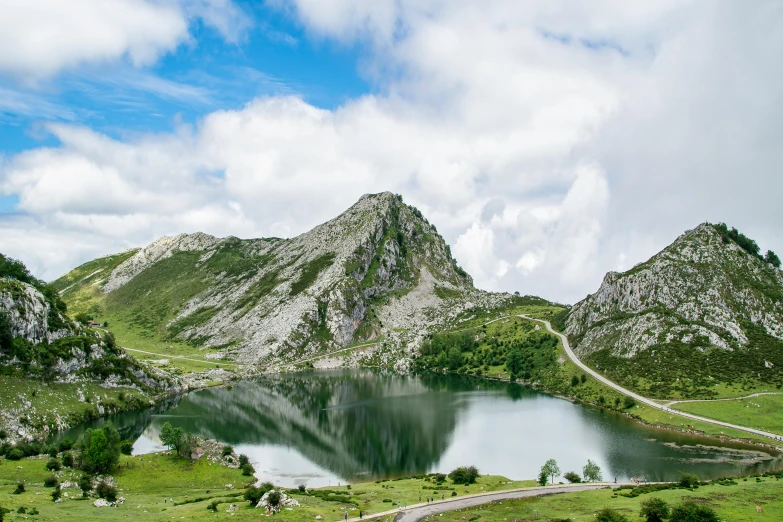 mountains rise over a large body of water