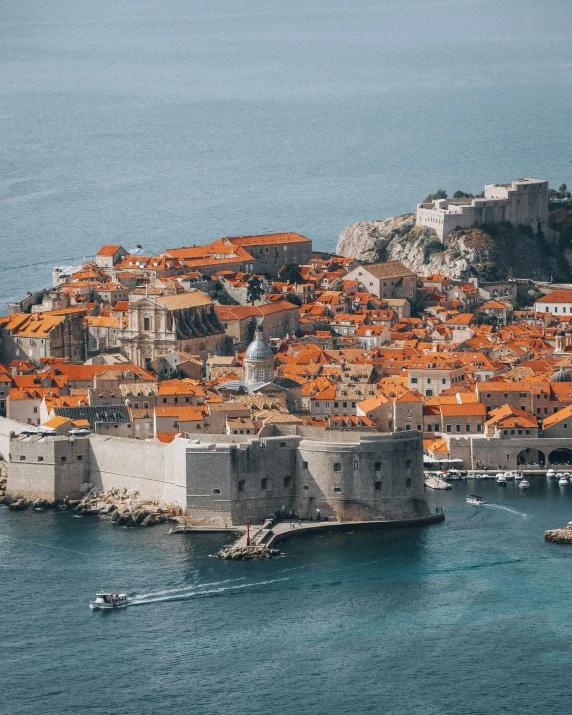 a view from a boat looking at a bunch of buildings that are mostly orange