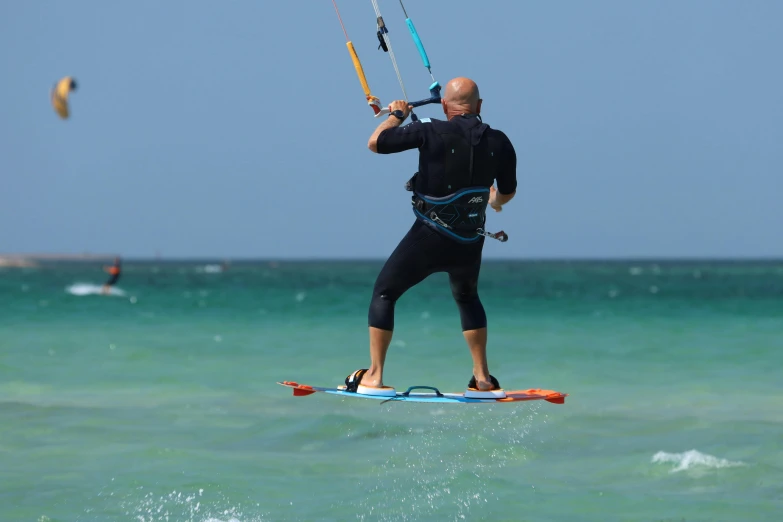 a man is in the air on a board