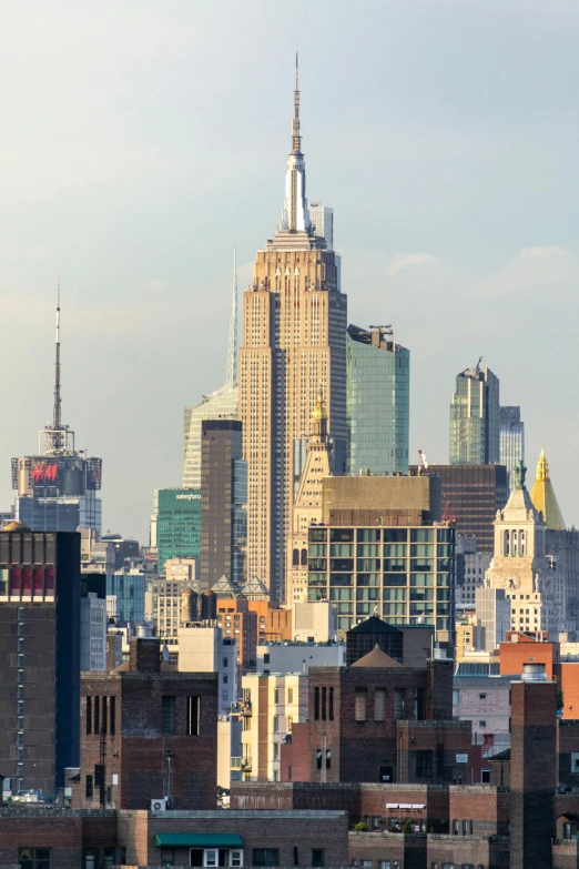 there are some buildings with tops up and skyscrs in the background