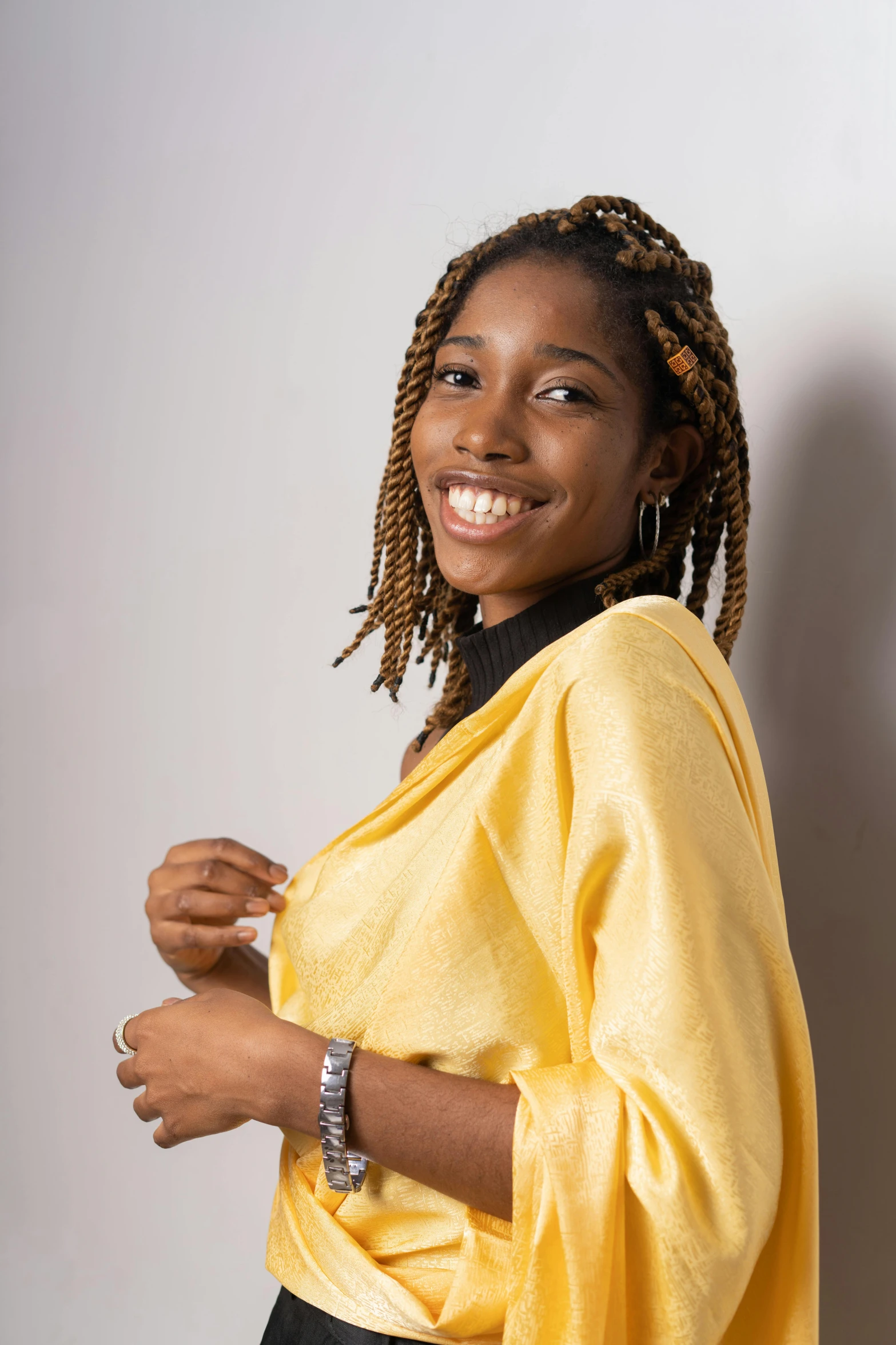 a woman with ids smiles for the camera