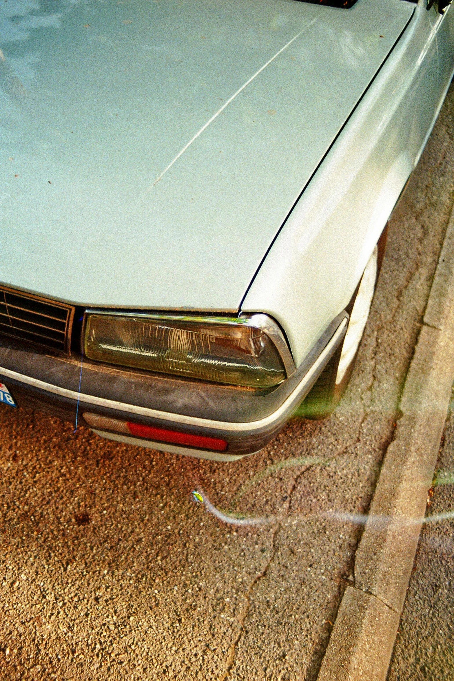 this is a car on the street without wheels