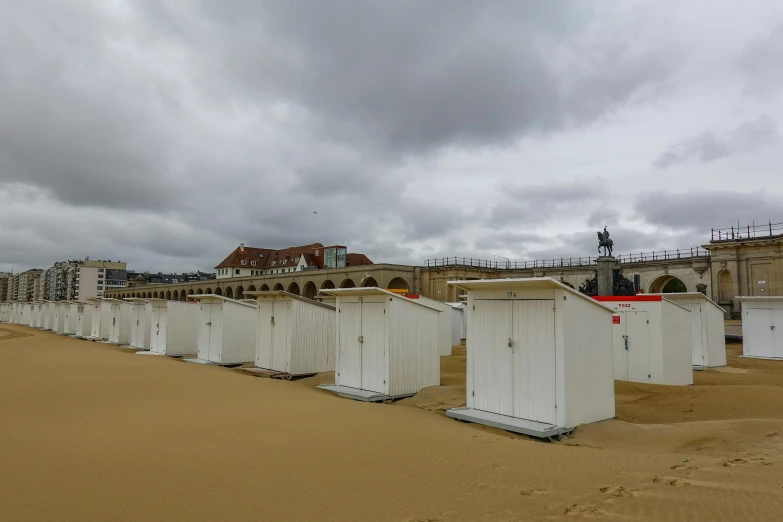 some small white houses that are on the beach