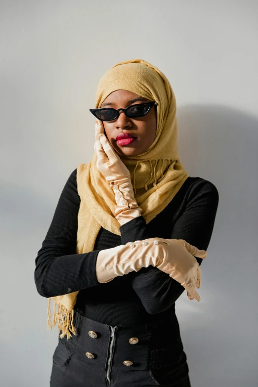 woman wearing glasses with finger and fingerless gloves