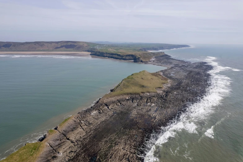 a shoreline line and body of water at the edge of the ocean