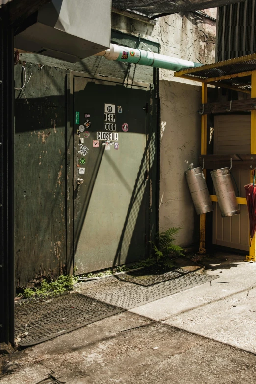 a closed garage with garbage cans and open fire hydrant