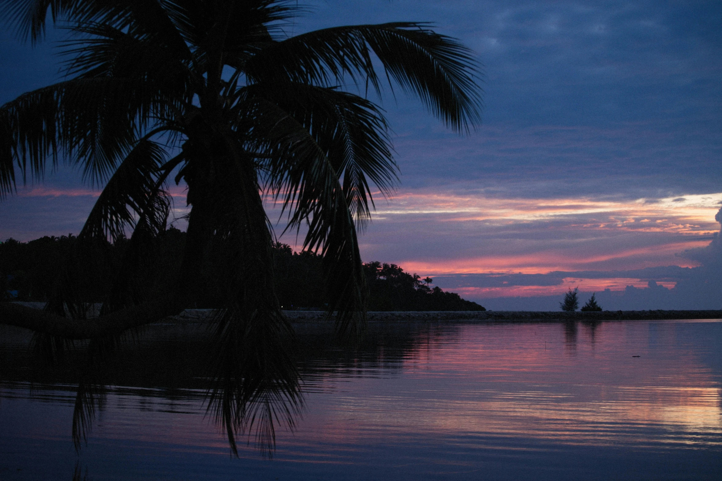 the sunsets as seen from an ocean shore