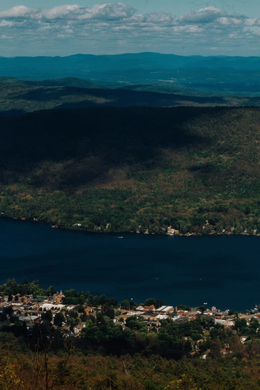 a view of the surrounding hills and trees and a lake