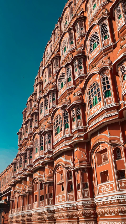 a large building is against a blue sky