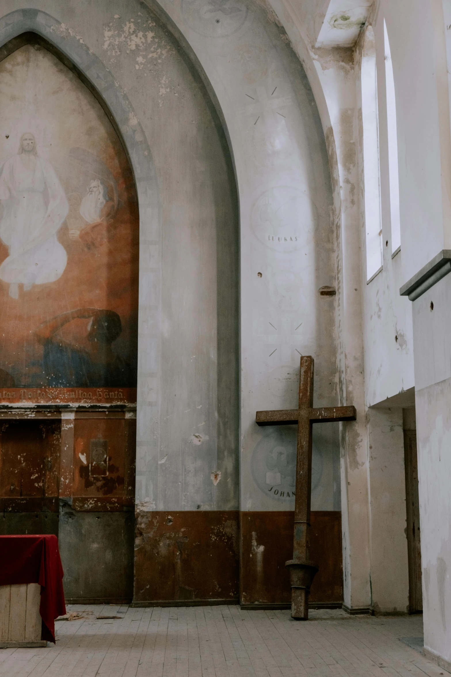 the altar of an old church with a jesus painting on it