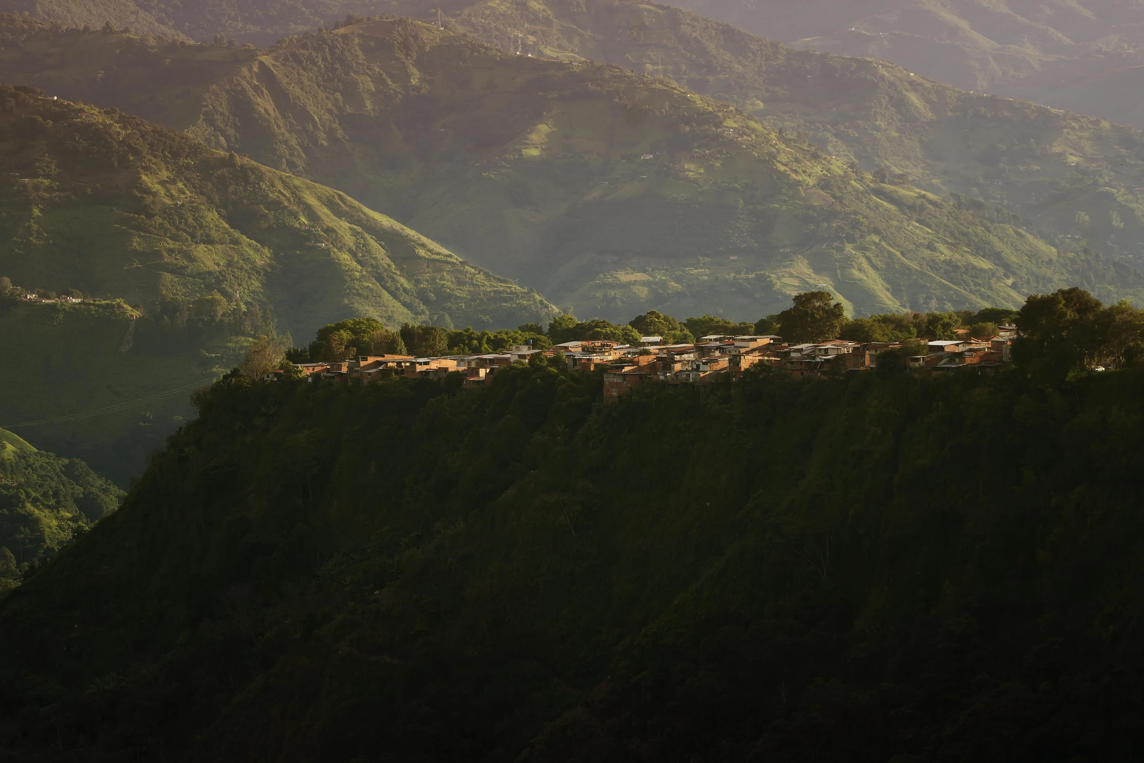 a mountain with a small town in the foreground