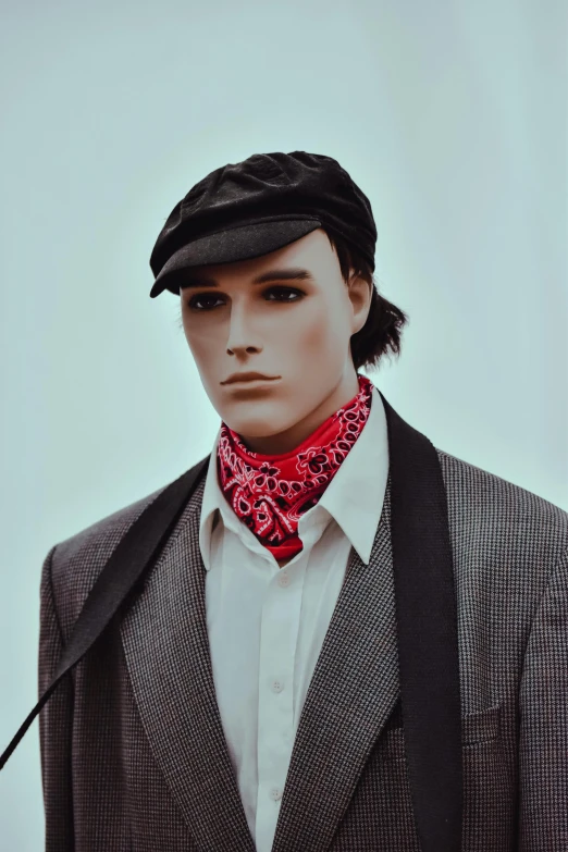 a mannequin with a red neck scarf