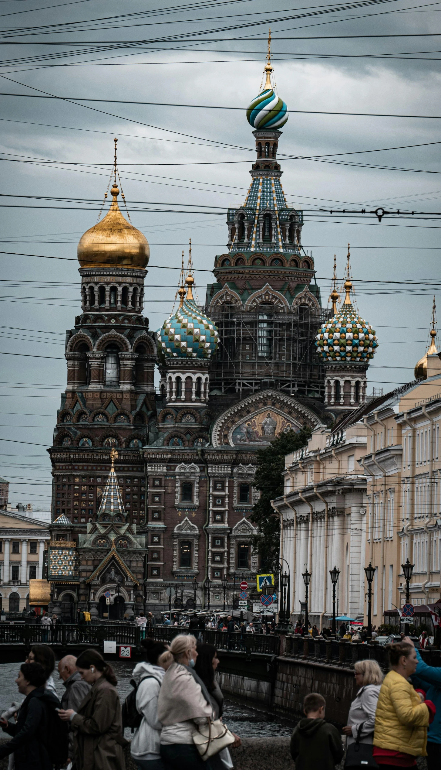 an ornate church surrounded by a bridge and river