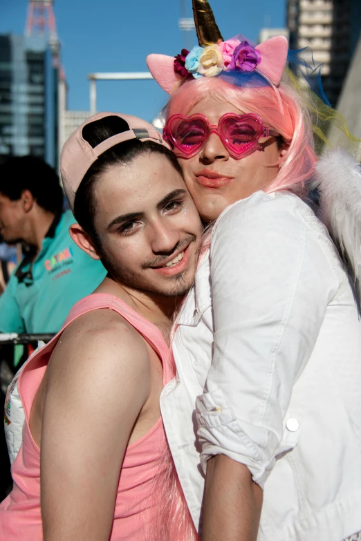 two people pose for a picture at an event