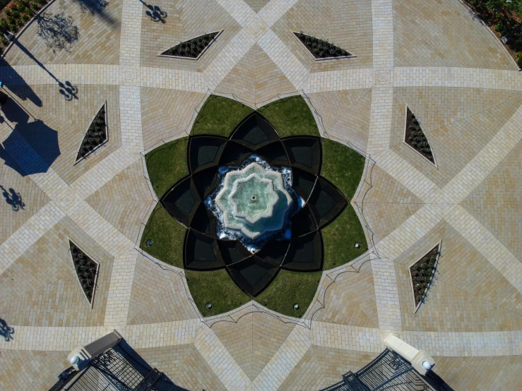 a circle shaped mosaic pattern on cement