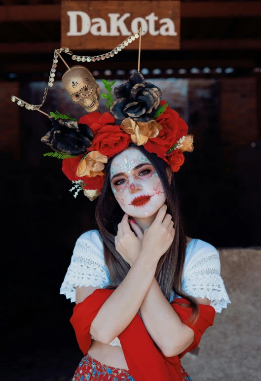 a girl has makeup on and flowers in her hair