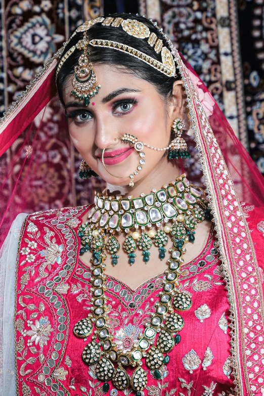 a woman wearing jewellery with an elaborate head piece