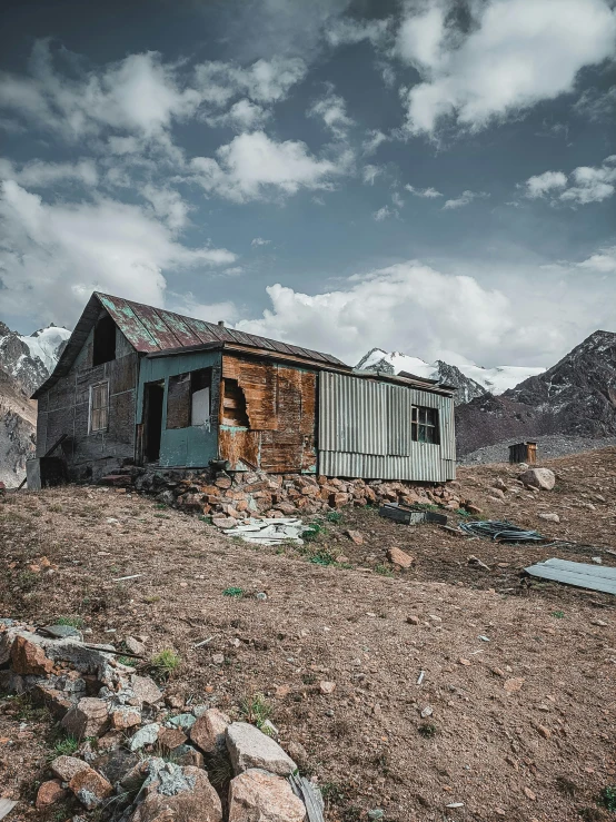 a house is on top of a mountain in the distance