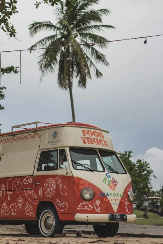 a vintage style van is parked in the parking lot