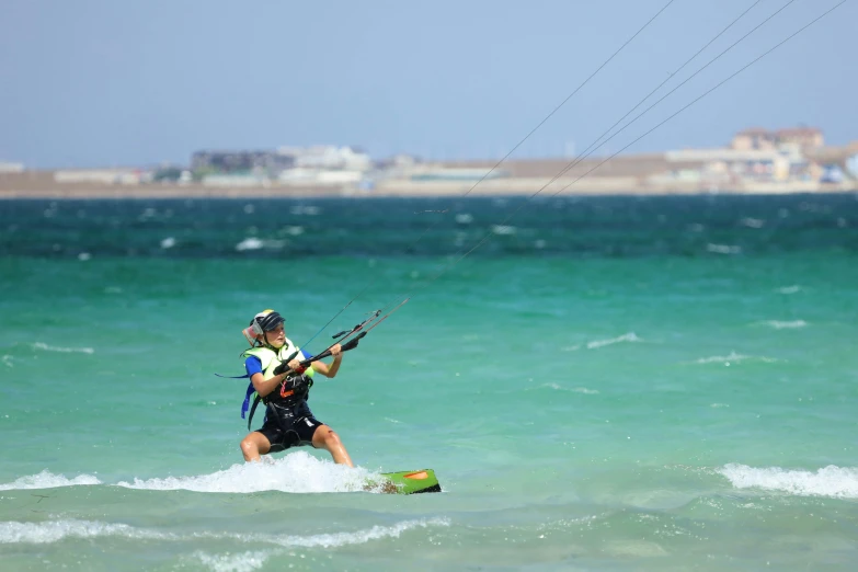 a man with a parachute in the ocean