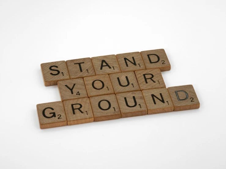 scrabbled wooden blocks spelling the words stand your ground