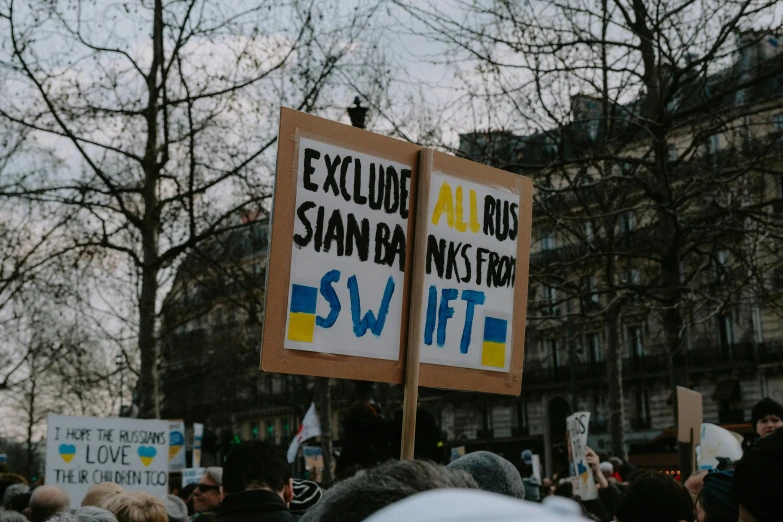 two protest signs showing you cannot know where to stand