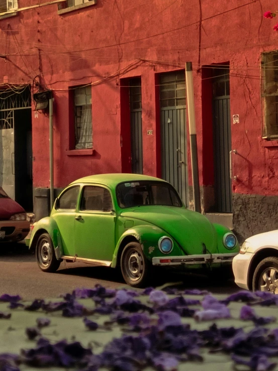 an old car parked along the side of a road