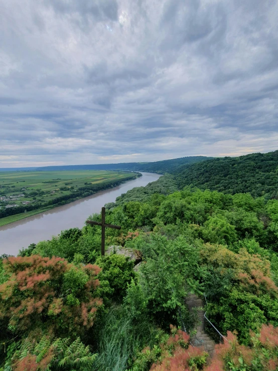 a scenic view of a river from a hill side