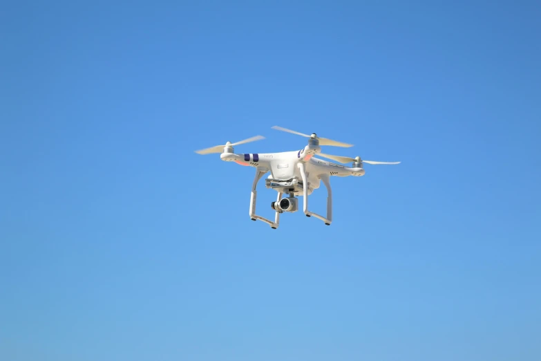 a white propellerless plane flying through the air