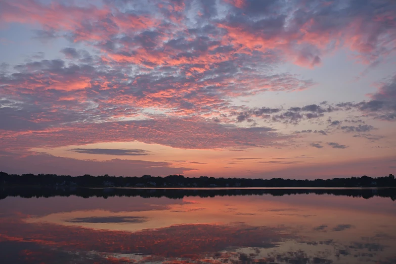 a large lake surrounded by a bunch of clouds