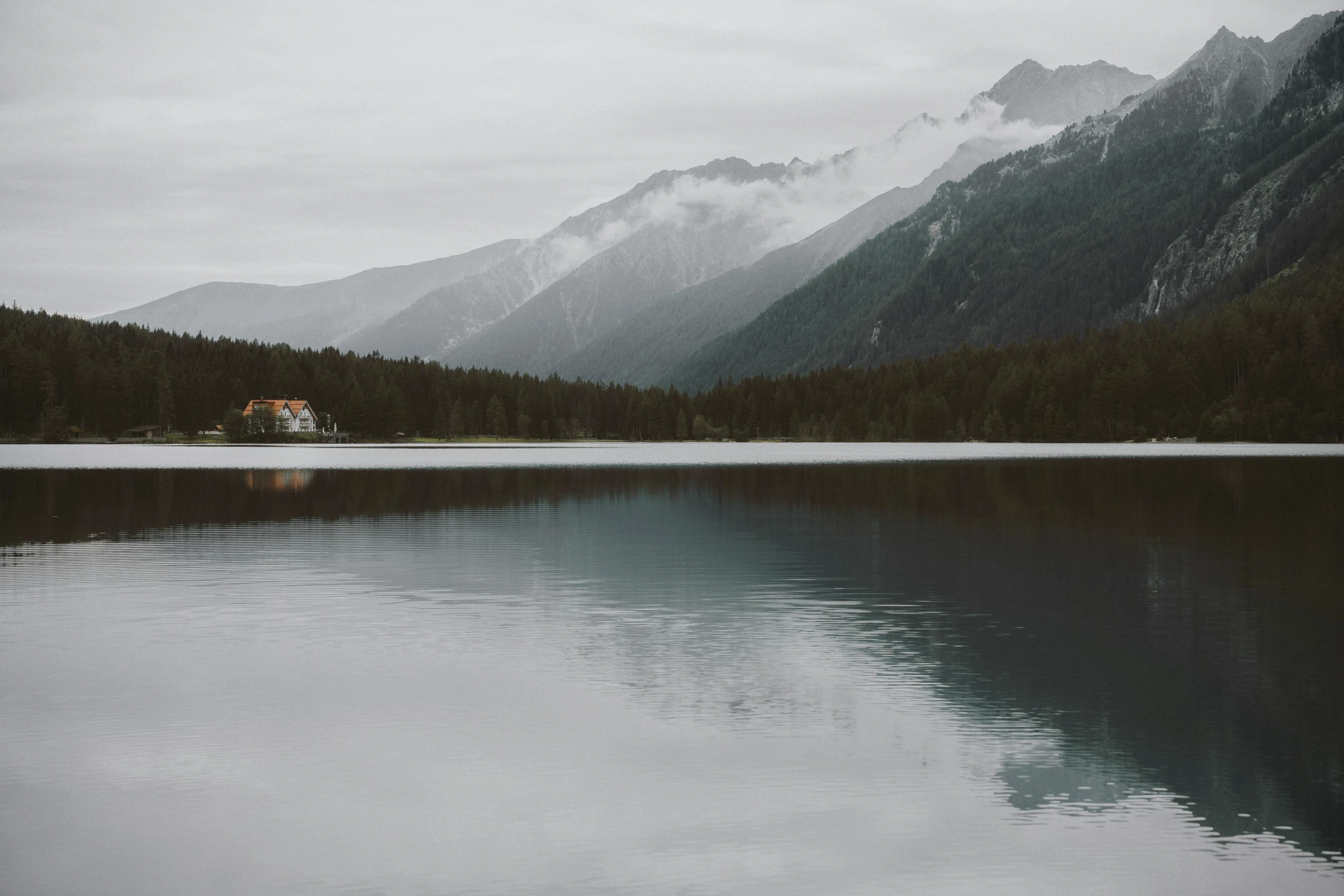 the water looks like a calm mountain lake