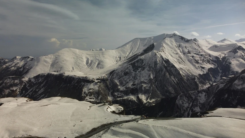 a scenic po taken of some snow covered mountains