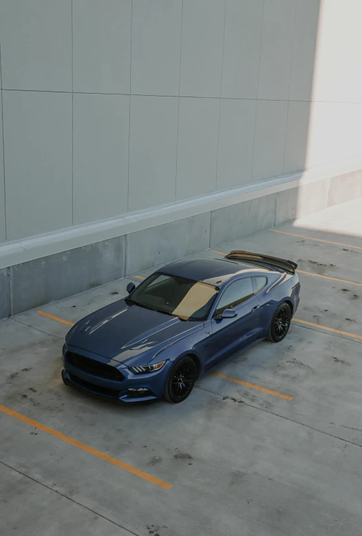 an electric mustang that is parked on a parking lot