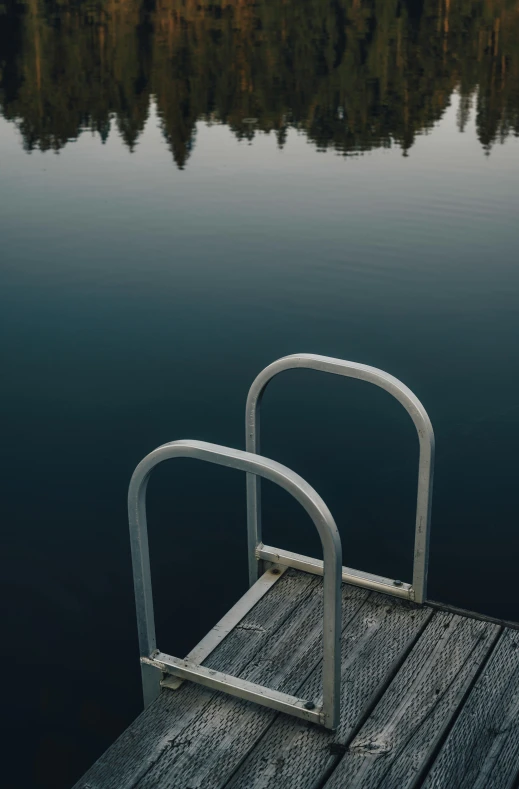 the boat dock has a pair of metal bars