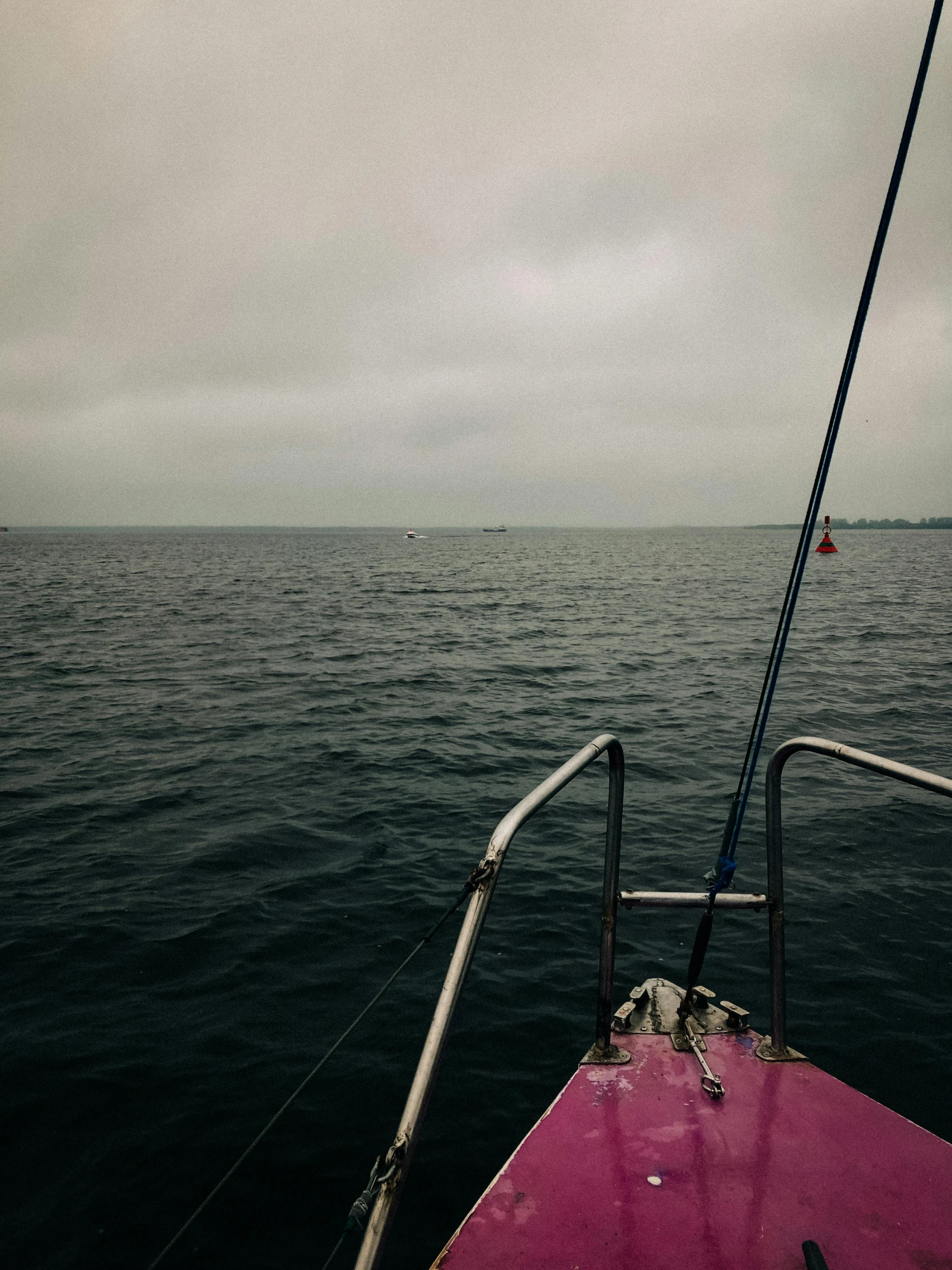 an ocean view with choppy water and cloudy sky